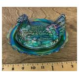 Iridescent blue glass hen on nest