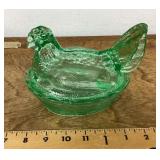 Green glass hen on a nest