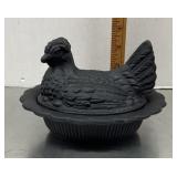 Black glass hen on a nest