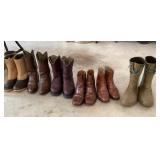 Group of men's boots under table