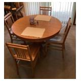 45' round oak pedestal table with 4 chairs