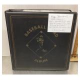 Baseball card album with baseball cards