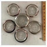 5 silverplate coasters and one sterling coaster