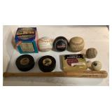 Baseballs, hockey pucks, mini bat, baseball book