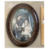Antique oval framed portrait with bubble glass
