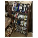 VHS tapes and books with small shelf
