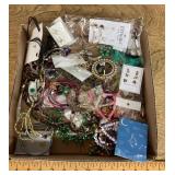 Flat of costume jewelry
