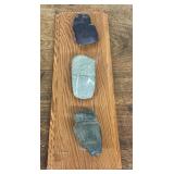 Indian artifacts mounted on pine board