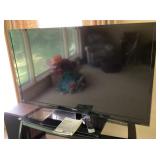 55" Toshiba television and remote