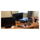 Electronics and items on top of desk