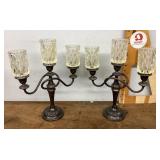 2 candelabras with hurricane glass