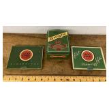 Lucky Strike and Remington tins