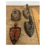 3 sad irons and cast iron trivet