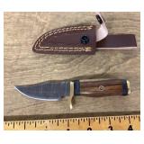 Fixed blade pocket knife with sheath