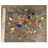 Assorted key chains and plastic charms