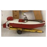 Vintage tin plate motor boat and trailer