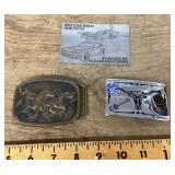 2 belt buckles and a car show plaque
