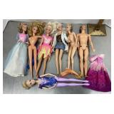 Group of Barbie and Ken dolls