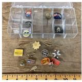 Container of buttons, pins, tie tacks, tie bars