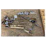 Collection of tie tacks, tie bars, and cufflinks