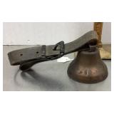 Bell with leather strap and buckle