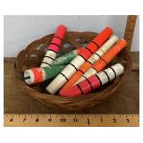 Basket of vintage wooden pole floats