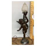Bronze cherub lamp on marble base