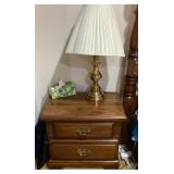 Pair of nightstands with brass lamps