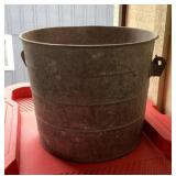 Galvanized bucket filled with straps