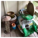 Group of gardening supplies and bird feeder