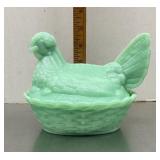 Jadeite green hen on a nest