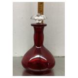 Red glass perfume bottle
