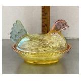 Multi-color glass hen on a nest