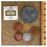 Collection of novelty coins and dollar bill
