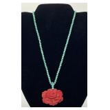 Turquoise bead necklace with carved coral rose