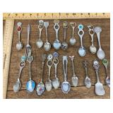 Souvenir spoons and one fork
