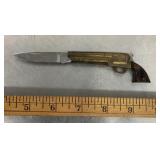 Novelty folding pocket knife shaped like a gun