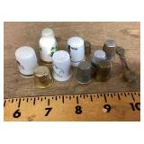 11 thimbles and a collector spoon