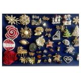 Group of costume jewelry brooches and pins