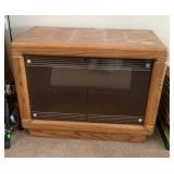 Oak media cabinet with glass doors