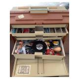 Storage case full of sewing supplies