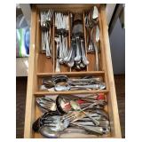 Stainless flatware in kitchen drawer