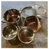 Assorted stainless pots and pans