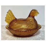 Amber glass hen on a nest