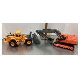 2 plastic earthmover toys