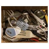 Utensils and linens in kitchen drawers