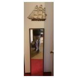 Full length mirror and ship wall decor