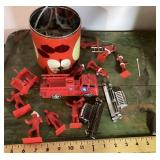 Can of plastic fireman toys