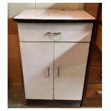 Metal kitchen cabinet with enamel top