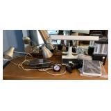 Contents on dresser with desk lamps, etc.